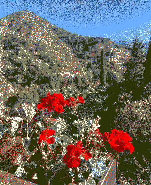 Dithered mountain landscape with blue skies and a red flower in the foreground.